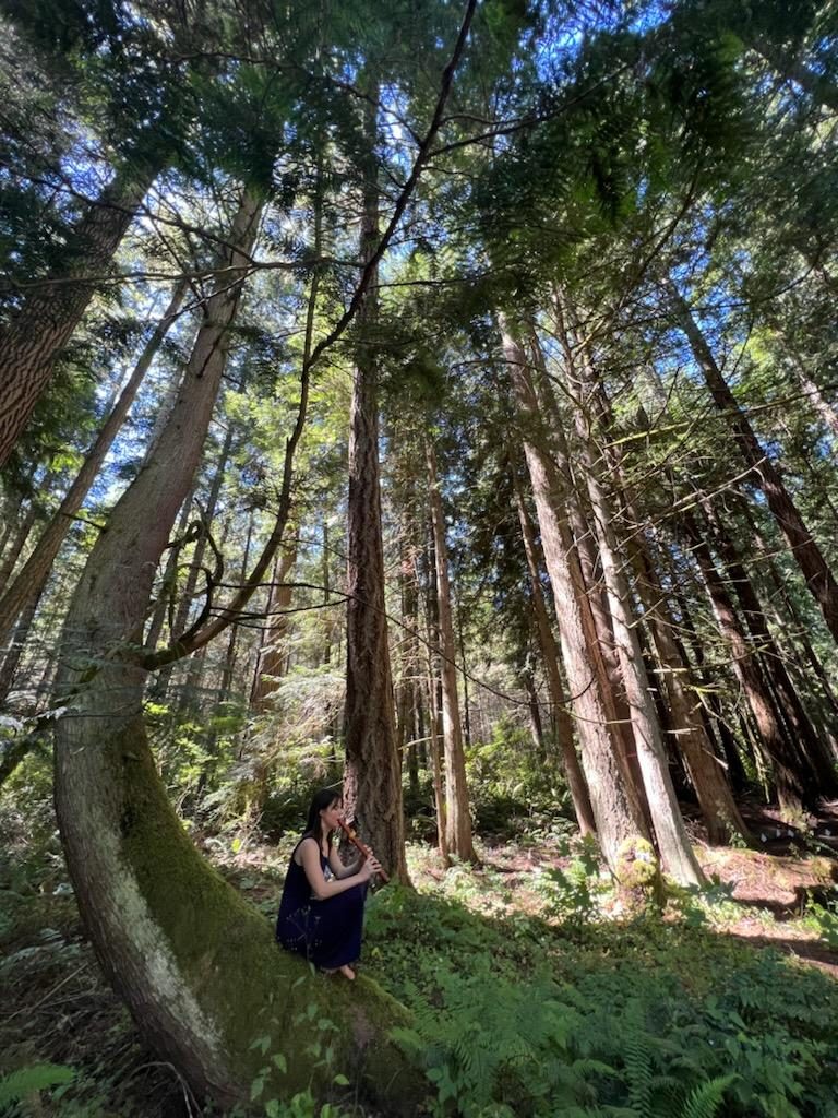 Playing flute in the forest